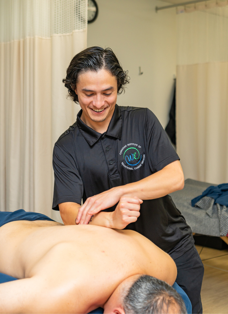 A CITCM student applies massage techniques during supervised clinical practice